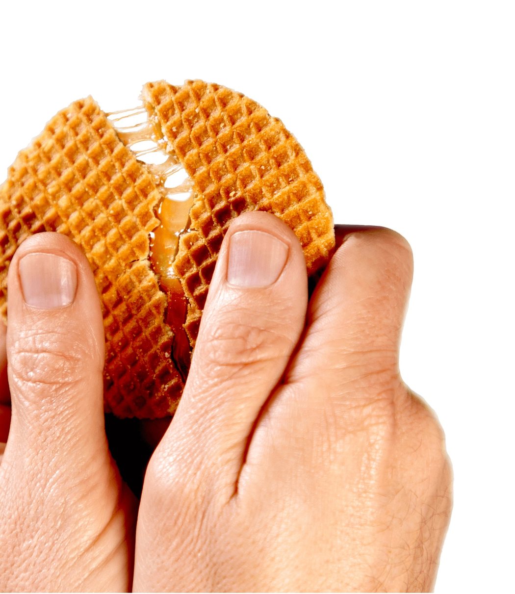 Tregroes caramel waffle pulled apart to reveal its gooey caramel centre